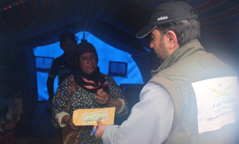 Distributing money to the displaced
